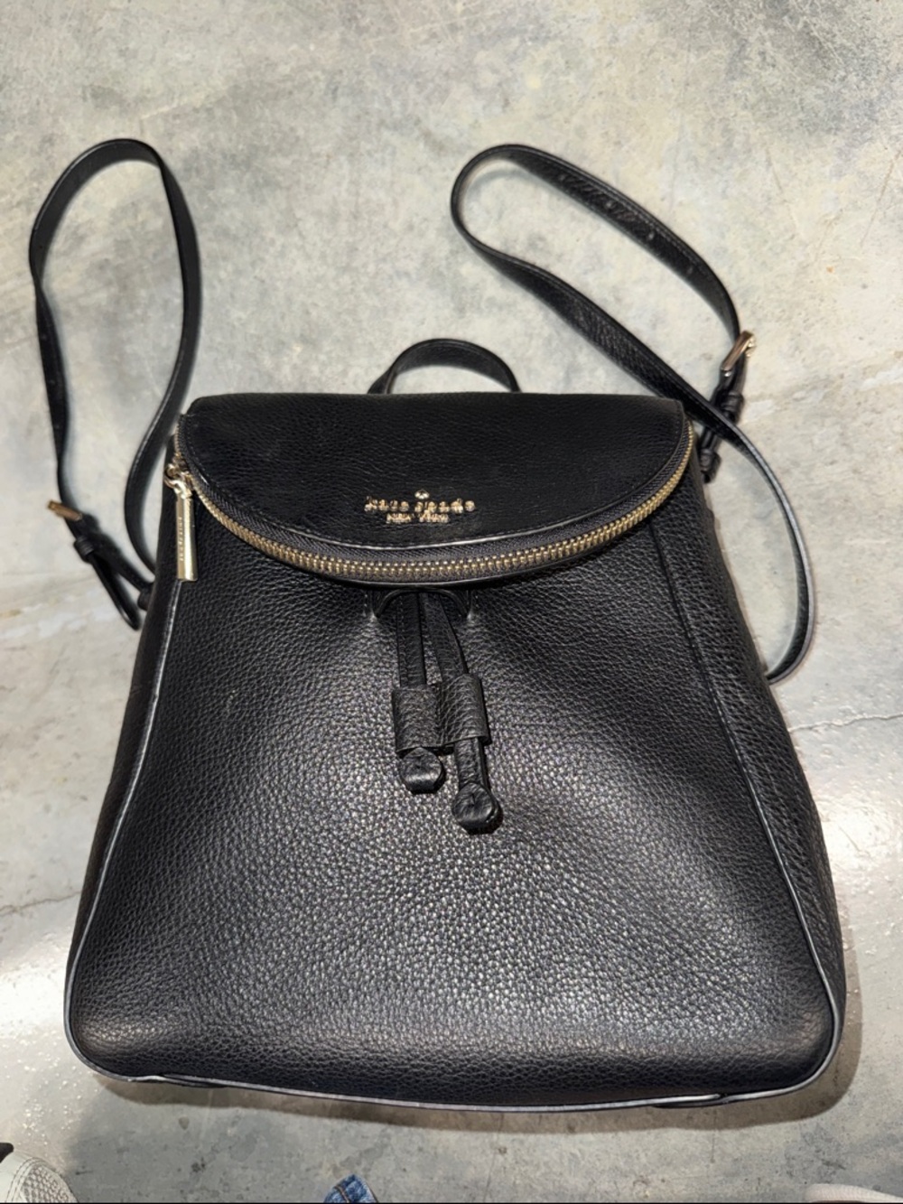 kate spade Black Pebbled Leather Drawstring Backpack with Gold Trim
